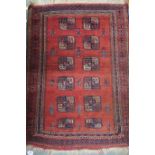 A Persian terracotta ground rug with lozenge design, 125cm long x 94cm wide Condition Report: