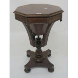 A Victorian rosewood octagonal sewing table with hinged top on quatrefoil base, 71cm high