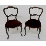A pair of Victorian walnut framed balloon back parlour chairs, 84cm high Condition Report: Available