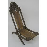 A 19th century carved Indian hardwood folding chair with rattan seat, 89cm high Condition Report:
