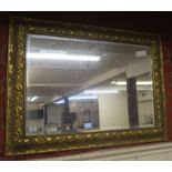 A gilt framed bevel glass wall mirror, 77cm high x 105cm wide Condition Report: Available upon