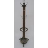 A Victorian oak hat & coat stand on three scrolled feet, 187cm high Condition Report: Available upon