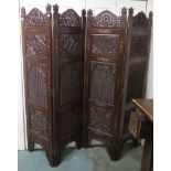 A modern carved hardwood and brass inlaid four panel room divider, 183cm high x 45cm wide (per