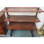 A Victorian mahogany three tier what-not with turned uprights and bun feet, 124cm high x 117cm