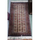 A beige ground eastern rug with allover design, 159cm long x 77cm wide Condition Report: Available