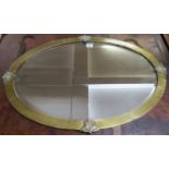 A Victorian brass framed bevel glassed oval wall mirror Condition Report: Available upon request