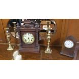 An oak cased mantle clock,two brass candlesticks and another mantle clock (4) Condition Report: