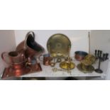 A lot of assorted brass and copper wares to include copper helmet coal hod,brass candle sticks,brass