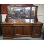 A Victorian mahogany inverted breakfront mirror back side board with three drawers above four