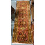 A terracotta ground Karajeh runner, 200cm long x 70cm wide Condition Report: Available upon request