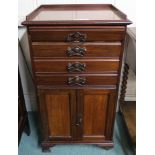 An early 20th century mahogany arts and crafts music cabinet with copper handles, 92cm high x 49cm