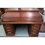 A 20th century oak roll top desk, 106cm high x 154cm wide x 93cm deep Condition Report: Available