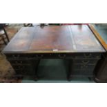 A Victorian mahogany pedestal desk on lions paw feet with lock stamped "J.T.NEEDS 100 NEW BOND ST