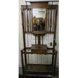 A 20th century oak mirror back hall stand, 196cm high x 93cm wide x 34cm deep Condition Report: