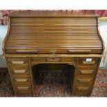 A 20th century oak roll top desk "Presented to Mr Alex. W. Stewart The Evening Times June 1920" ,