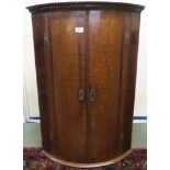 A Victorian oak two door corner cabinet, 93cm high Condition Report: Available upon request