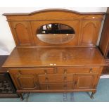 An Edwardian oak mirror back sideboard on cabriole supports, 162cm high x 153cm wide x 53cm deep