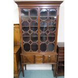 A Victorian mahogany glazed bookcase on tapering supports, 203cm high x 103cm wide x 35cm deep