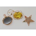 A 9ct Masonic Eastern Star brooch, a further 9ct yellow glass gem brooch and blood stone seal,