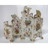 A French pottery flower painted vase modelled as a four fold screen Condition Report: Restoration,