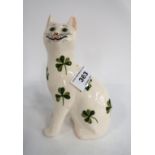 A Griselda Hill pottery cat painted with Shamrocks Condition Report: Available upon request