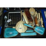 A tray lot including silver-handled knives, two silver teaspoons, dressing table set Condition