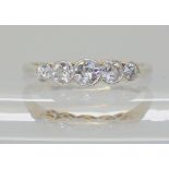 An 18ct white and yellow gold five stone diamond ring set with estimated approx 0.45cts, finger size