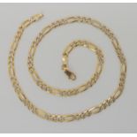 A 9ct yellow and white gold figaro chain, length 38cm, weight 11.3gms Condition Report: Available