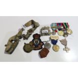 A lot comprising a group of four French military medals, two crosses, patches, buttons & a belt with