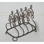 A silver toast rack, Birmingham 1904, 11.8cm long, 131gms Condition Report: Available upon request