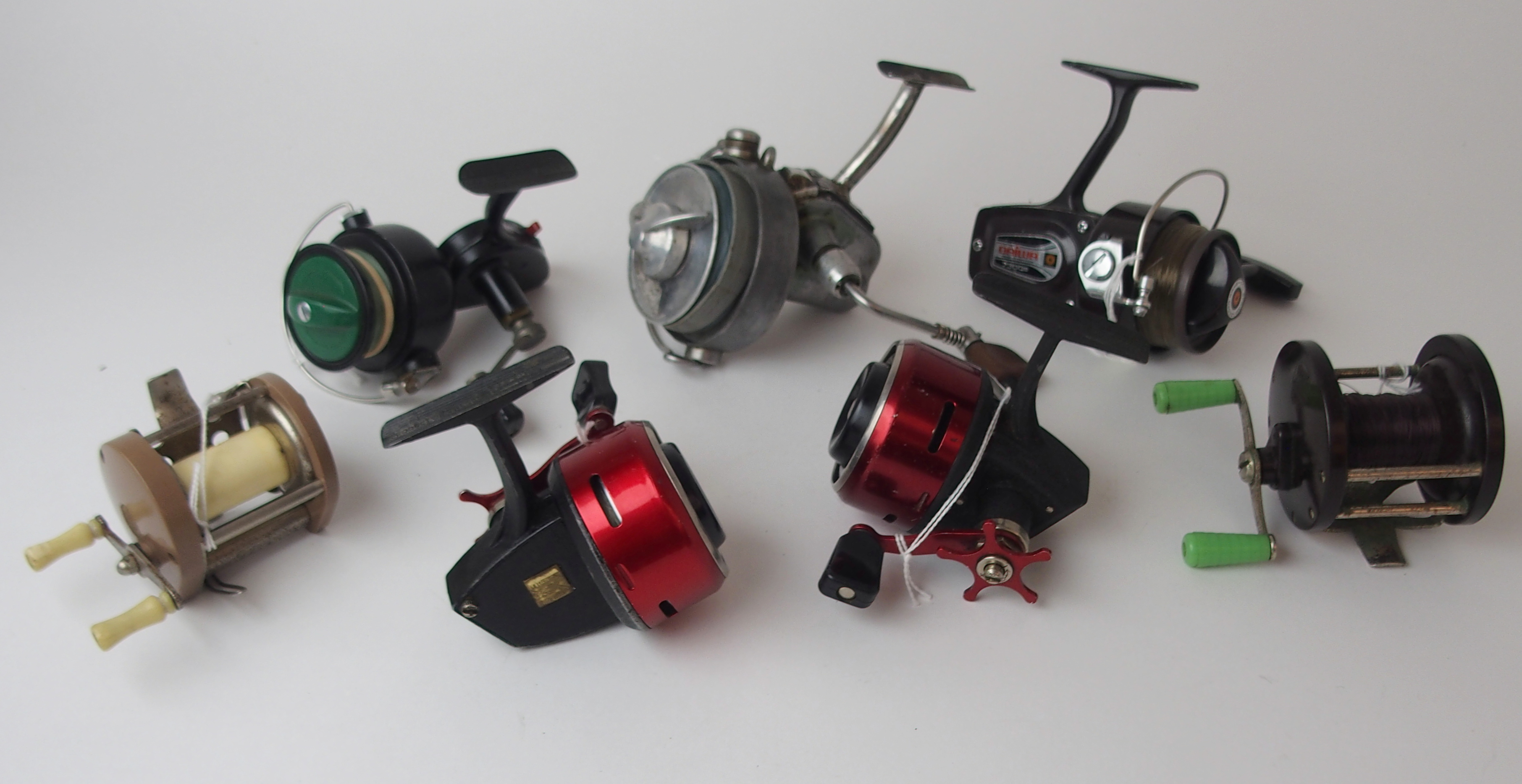 Seven various spinning reels comprising Silent Spin Flyte, Bretton 400, two stamped Cafaro Bros,