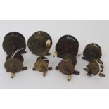Eight various brass reels, comprising 1 1/2 crank wind, 2 1/4in plate wind, 3 in crank wind with