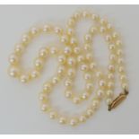 A string of pearls with good lustre and a 9ct clasp 46cm, largest pearl 8mm, smallest 4.4mm,