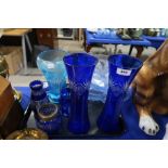 Assorted blue flashed cut glass, two pale blue pressed glass dishes and a iris decorated vase