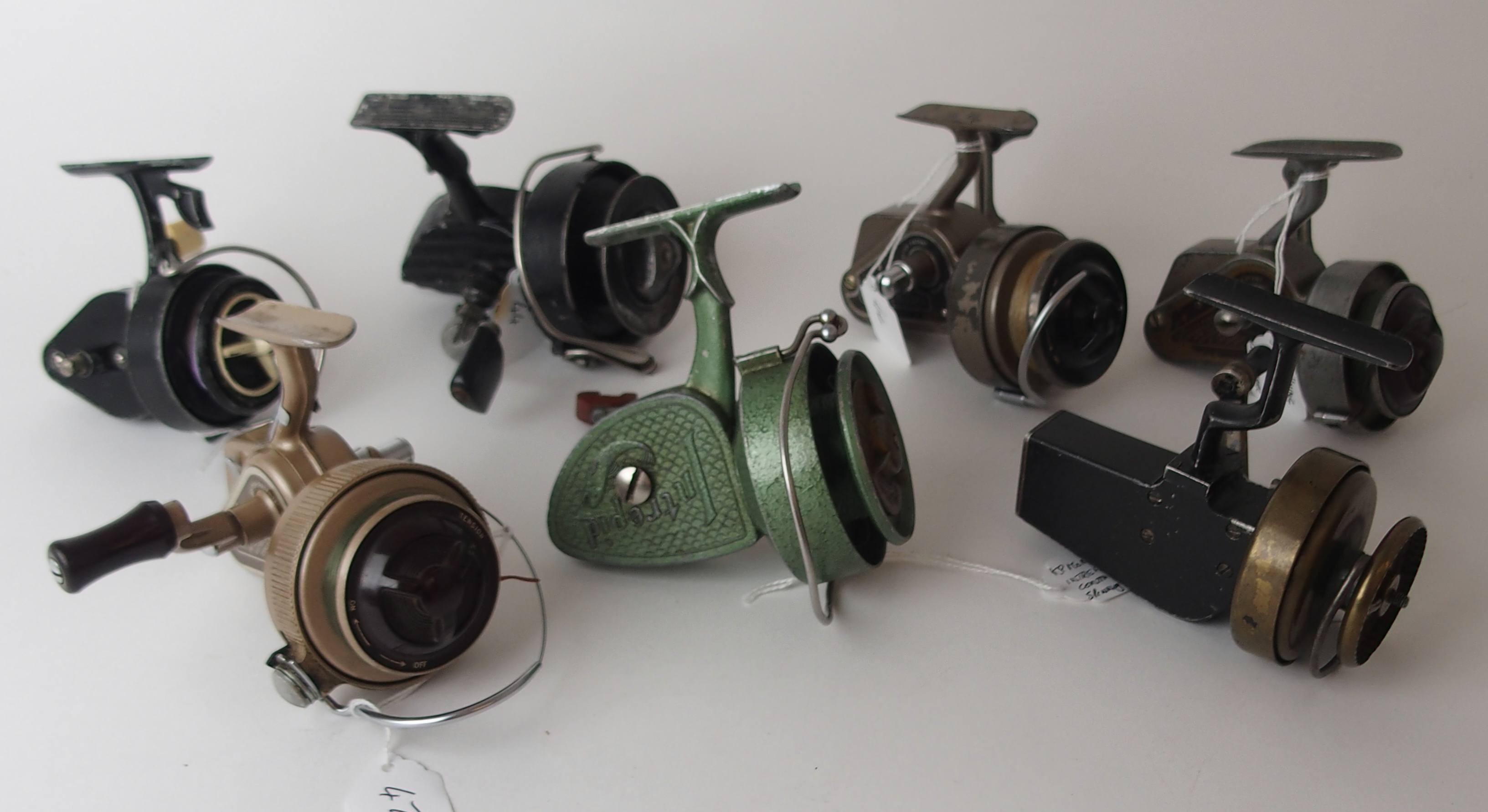 Seven various spinning reels comprising Dingley & Co, three KP Morritts Intrepid Continental, De