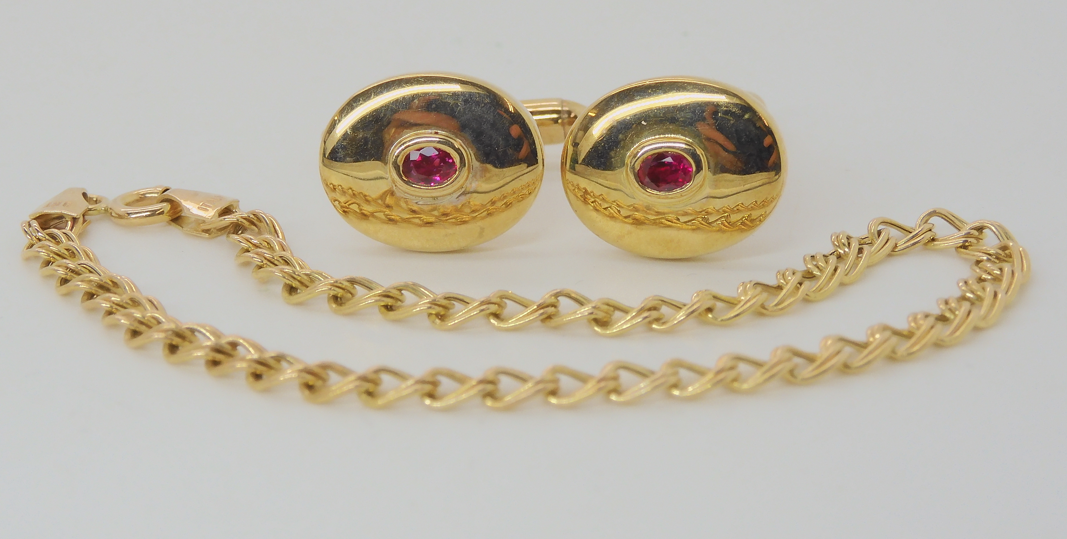 A pair of 9ct gold red gem set cufflinks, a green gem set ring, size P, and a double link chain - Image 2 of 5