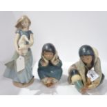 Two Lladro Eskimo children and a Nao figure of a girl and rabbit Condition Report: Available upon