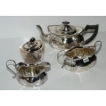 A three piece EP tea service and a tea caddy Condition Report: Available upon request