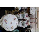 A lot comprising a floral and gilt decorated dessert service comprising plates, comports & tazzas,