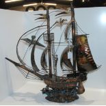 A metal model of a galleon, 66cm wide and a model fort (2) Condition Report: Available upon request