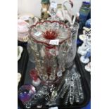 A frosted glass pitcher decorated with butterflies and foliage, a Victorian cut glass lustre,