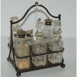 An EP and glass six bottle cruet stand Condition Report: Available upon request