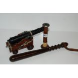 A hardwood truncheon, book trough, table canon and egg timer (4) Condition Report: Available upon