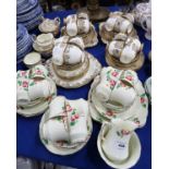 A Salisbury China tea set decorated with pink roses and gilding comprising six plates, saucers and