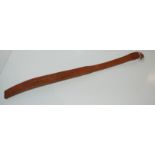A tan leather tawse by John.J.Dick Condition Report: Available upon request
