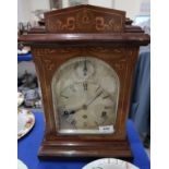 A German inlaid mantle clock, with silvered dial, the movement marked Wurttemberg, 6367 Condition