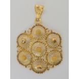 A bright yellow metal filligree pendant, diameter 3.9cm weight 7.1gms Condition Report: Available
