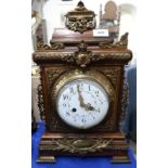 A wooden and ormolu mounted mantle clock the dial with painted swags Condition Report: Available