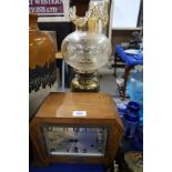 An Art Deco mantle clock and a brass oil lamp Condition Report: Available upon request