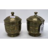 A pair of Eastern brass pots and covers Condition Report: Available upon request